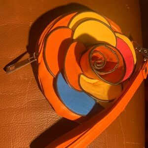 Accessorize With Accessories! Orange floral wrist purse . O/S